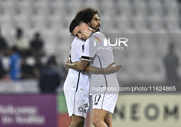 Akram Hassan Afif (L) and Cristo Ramon Gonzalez Perez (R) of Al Sadd SC celebrate after winning the AFC Champions League elite west football...