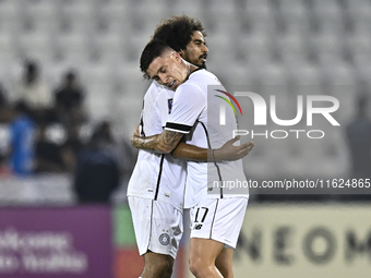 Akram Hassan Afif (L) and Cristo Ramon Gonzalez Perez (R) of Al Sadd SC celebrate after winning the AFC Champions League elite west football...