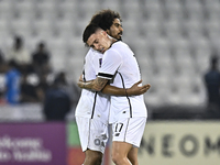 Akram Hassan Afif (L) and Cristo Ramon Gonzalez Perez (R) of Al Sadd SC celebrate after winning the AFC Champions League elite west football...