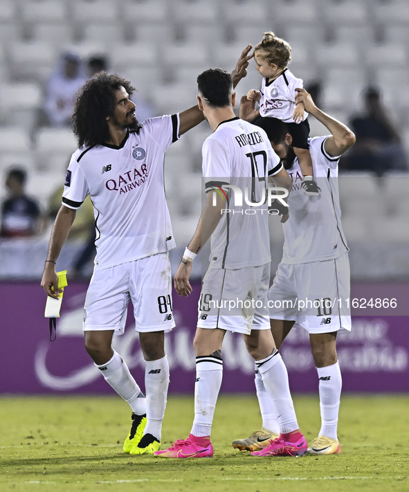 Akram Hassan Afif (L), Rafael Sebastian Mujica Garcia (C), and Hasan Khalid Alhaydos (R) of Al Sadd SC celebrate after winning the AFC Champ...