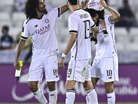 Akram Hassan Afif (L), Rafael Sebastian Mujica Garcia (C), and Hasan Khalid Alhaydos (R) of Al Sadd SC celebrate after winning the AFC Champ...