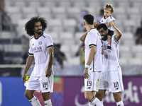 Akram Hassan Afif (L), Rafael Sebastian Mujica Garcia (C), and Hasan Khalid Alhaydos (R) of Al Sadd SC celebrate after winning the AFC Champ...