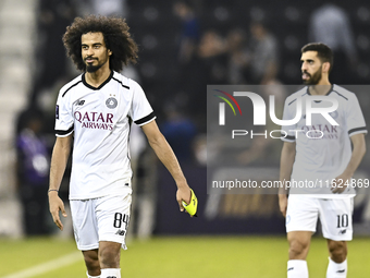 Akram Hassan Afif of Al Sadd SC celebrates after winning the AFC Champions League elite west football match between Qatar's Al Sadd SC and I...