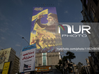 A giant banner featuring a portrait of Lebanon's Hezbollah Secretary General, Hassan Nasrallah, who was killed in an Israeli air strike in t...