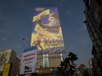 A giant banner featuring a portrait of Lebanon's Hezbollah Secretary General, Hassan Nasrallah, who was killed in an Israeli air strike in t...