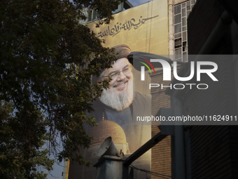 A giant banner featuring a portrait of Lebanon's Hezbollah Secretary General, Hassan Nasrallah, who was killed in an Israeli air strike in t...