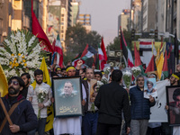 Iranian protesters carry portraits of Lebanon's Hezbollah Secretary General, Hassan Nasrallah, and an Islamic Revolutionary Guard Corps' (IR...