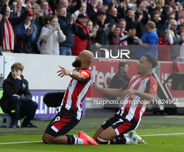 Brentford's Bryan Mbeumo scores in the first minute during the Premier League match between Brentford and West Ham United at the Gtech Commu...