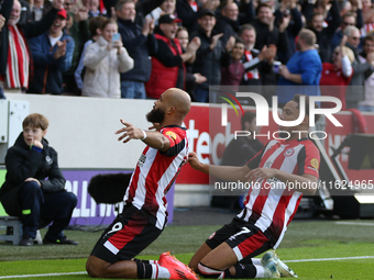 Brentford's Bryan Mbeumo scores in the first minute during the Premier League match between Brentford and West Ham United at the Gtech Commu...