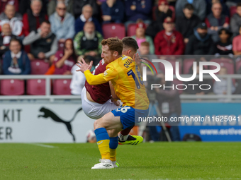 Northampton Town's Aaron McGowan is fouled by Mansfield Town's Stephen Quinn during the first half of the Sky Bet League 1 match between Nor...