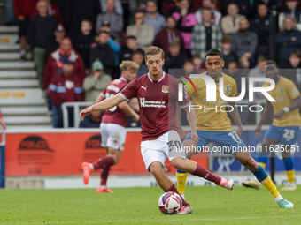 Northampton Town's Samy Chouchane is shadowed by Mansfield Town's Keanu Baccus during the second half of the Sky Bet League 1 match between...