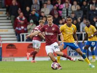 Northampton Town's Samy Chouchane is shadowed by Mansfield Town's Keanu Baccus during the second half of the Sky Bet League 1 match between...