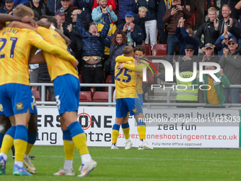 Aaron Lewis celebrates after scoring for Mansfield Town, extending their lead to 2-0 against Northampton Town during the second half of the...