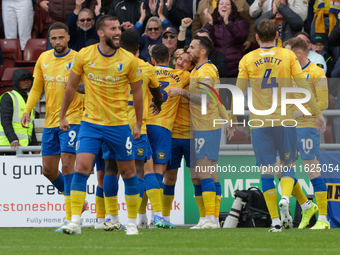 Aaron Lewis celebrates after scoring for Mansfield Town, extending their lead to 2-0 against Northampton Town during the second half of the...