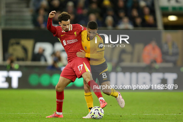 Liverpool's Curtis Jones in action with Joao Gomes of Wolverhampton Wanderers during the Premier League match between Wolverhampton Wanderer...