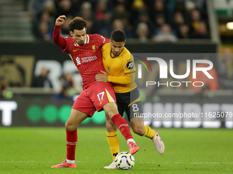 Liverpool's Curtis Jones in action with Joao Gomes of Wolverhampton Wanderers during the Premier League match between Wolverhampton Wanderer...