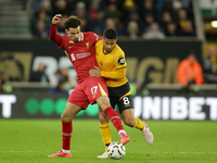 Liverpool's Curtis Jones in action with Joao Gomes of Wolverhampton Wanderers during the Premier League match between Wolverhampton Wanderer...