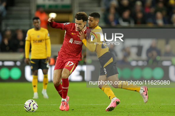 Liverpool's Curtis Jones in action with Joao Gomes of Wolverhampton Wanderers during the Premier League match between Wolverhampton Wanderer...