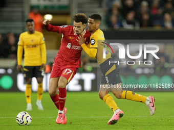 Liverpool's Curtis Jones in action with Joao Gomes of Wolverhampton Wanderers during the Premier League match between Wolverhampton Wanderer...