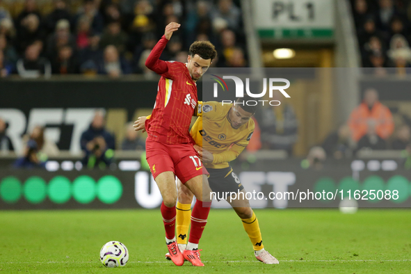 Liverpool's Curtis Jones in action with Joao Gomes of Wolverhampton Wanderers during the Premier League match between Wolverhampton Wanderer...