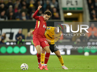 Liverpool's Curtis Jones in action with Joao Gomes of Wolverhampton Wanderers during the Premier League match between Wolverhampton Wanderer...