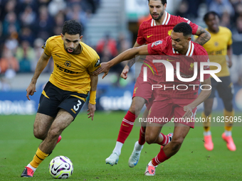 Rayan Ait-Nouri of Wolves (L) battles with Trent Alexander-Arnold of Liverpool during the Premier League match between Wolverhampton Wandere...