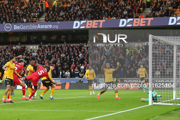 Liverpool's Ibrahima Konate heads them into a 1-0 lead during the Premier League match between Wolverhampton Wanderers and Liverpool at Moli...