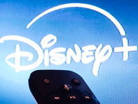 Disney+ app displayed on a tv screen and a remote control are seen in this illustration photo taken in Krakow, Poland on September 30, 2024....