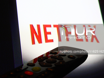 Netflix app displayed on a tv screen and a remote control are seen in this illustration photo taken in Krakow, Poland on September 30, 2024....