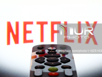 Netflix app displayed on a tv screen and a remote control are seen in this illustration photo taken in Krakow, Poland on September 30, 2024....