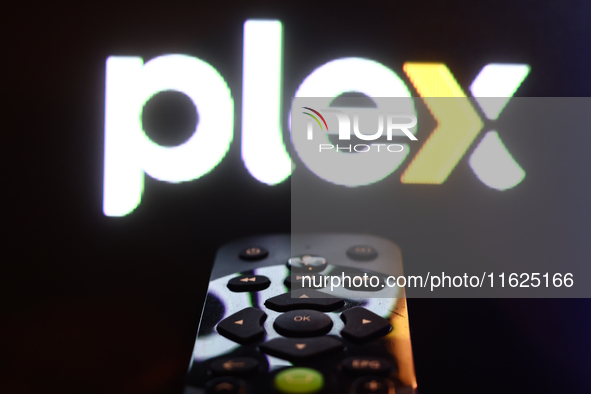 Plex app displayed on a tv screen and a remote control are seen in this illustration photo taken in Krakow, Poland on September 30, 2024. 