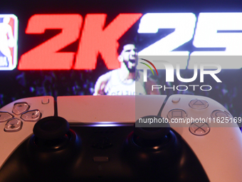 NBA 2K25 displayed on a tv screen and  DualSense controller are seen in this illustration photo taken in Krakow, Poland on September 30, 202...