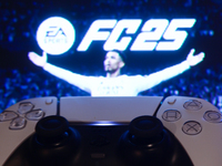 EA Sports FC 25 displayed on a tv screen and  DualSense controller are seen in this illustration photo taken in Krakow, Poland on September...