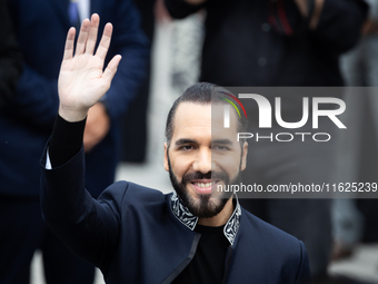 El Salvador's President Nayib Bukele waves as he attends an event at the monument to Libertador General San Martin in Buenos Aires, Argentin...