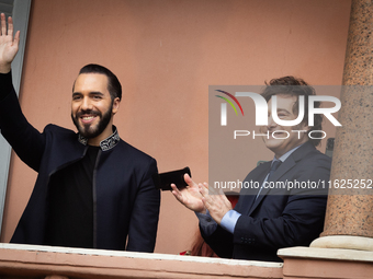 Argentina's President Javier Milei and El Salvador's President Nayib Bukele gesture from a balcony of the Casa Rosada Government House in Bu...