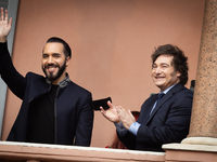 Argentina's President Javier Milei and El Salvador's President Nayib Bukele gesture from a balcony of the Casa Rosada Government House in Bu...