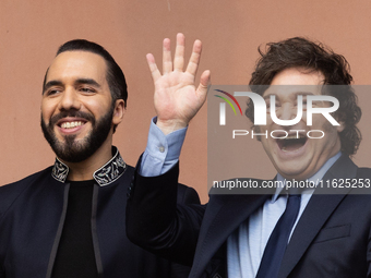 Argentina's President Javier Milei and El Salvador's President Nayib Bukele gesture from a balcony of the Casa Rosada Government House in Bu...