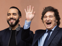 Argentina's President Javier Milei and El Salvador's President Nayib Bukele gesture from a balcony of the Casa Rosada Government House in Bu...