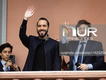 Argentina's President Javier Milei and El Salvador's President Nayib Bukele gesture from a balcony of the Casa Rosada Government House in Bu...