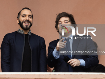 Argentina's President Javier Milei and El Salvador's President Nayib Bukele gesture from a balcony of the Casa Rosada Government House in Bu...