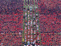 In Suqian, China, on September 30, 2024, 7,000 teachers and students gather at the campus sports field to hold a themed event called ''Repor...