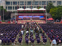 In Suqian, China, on September 30, 2024, 7,000 teachers and students gather at the campus sports field to hold a themed event called ''Repor...