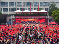 In Suqian, China, on September 30, 2024, 7,000 teachers and students gather at the campus sports field to hold a themed event called ''Repor...