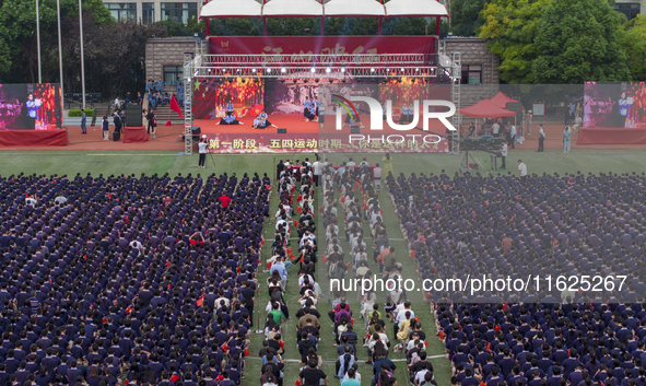 In Suqian, China, on September 30, 2024, 7,000 teachers and students gather at the campus sports field to hold a themed event called ''Repor...