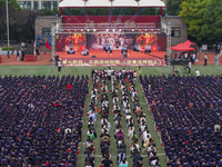 In Suqian, China, on September 30, 2024, 7,000 teachers and students gather at the campus sports field to hold a themed event called ''Repor...