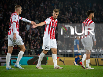 David Olafsson, Jakub Jugas, and Ajdin Hasic participate in the game between KS Cracovia and Stal Mielec in Krakow, Poland, on September 30,...