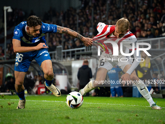 Bartosz Biedrzycki and Robert Dadok participate in the game between KS Cracovia and Stal Mielec in Krakow, Poland, on September 30, 2024. PK...