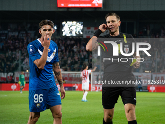 Robert Dadok of Stal and referee Patryk Gryckiewicz during the game between KS Cracovia and Stal Mielec in Krakow, Poland, on September 30,...