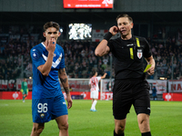 Robert Dadok of Stal and referee Patryk Gryckiewicz during the game between KS Cracovia and Stal Mielec in Krakow, Poland, on September 30,...