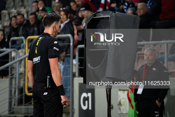 Referee Patryk Gryckiewicz checks the VAR screen during a game between KS Cracovia and Stal Mielec in Krakow, Poland, on September 30, 2024....